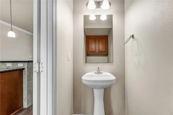a bathroom with a sink and a mirror
