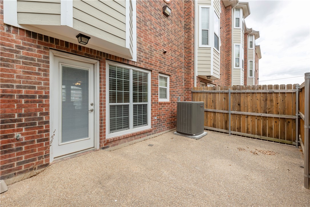 1198 Jones-Butler Road, Unit 606 College Station, TX 77840 - Photo 23 of 32 a view of a blue house with a large window