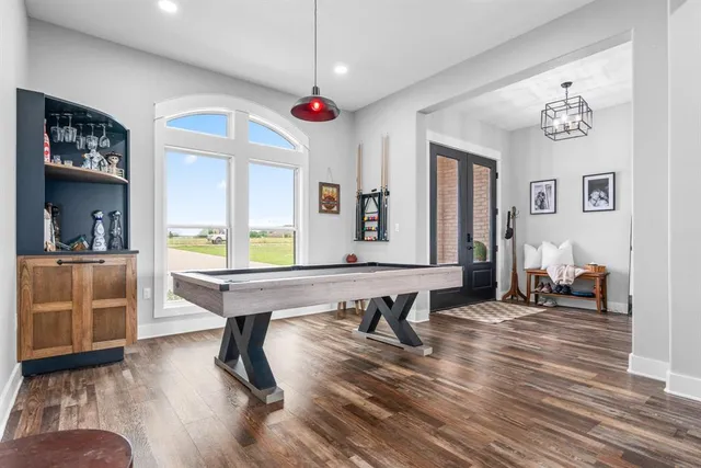 a view of a livingroom with furniture window and wooden floor