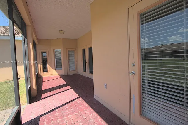 a front view of a house with a yard table and chairs
