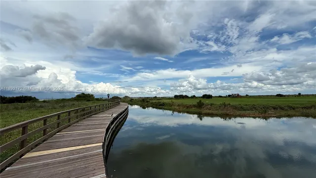 an aerial view of a house with outdoor space