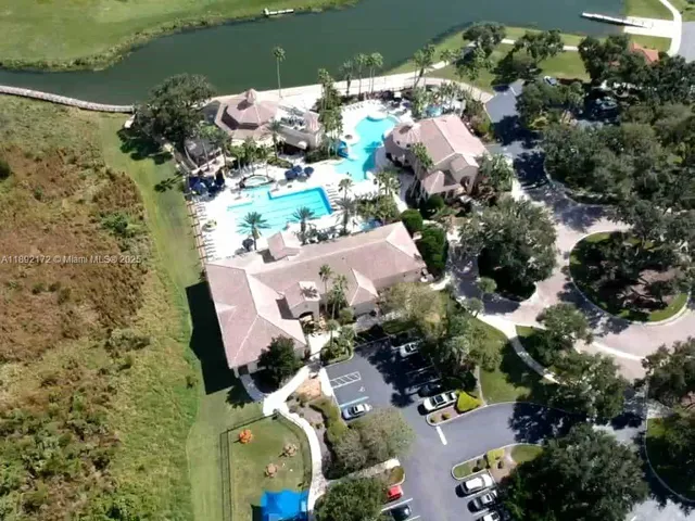 an aerial view of a house with a lake view