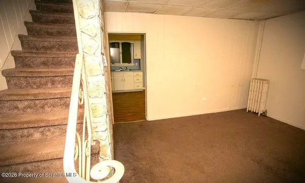 a kitchen with granite countertop a refrigerator and a stove