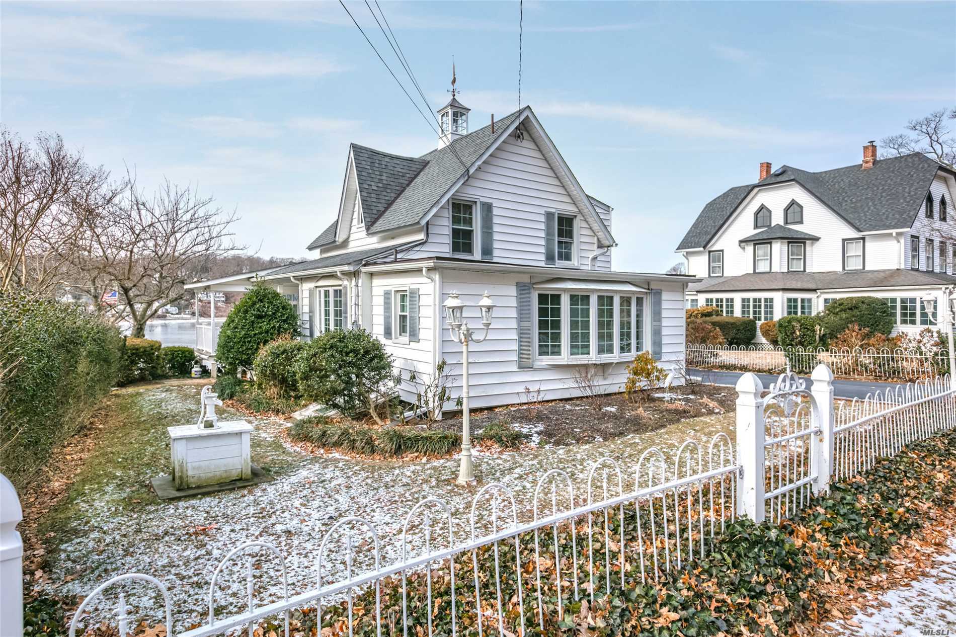 85 Prospect Road Centerport, NY 11721 - Photo 1 of 1 a view of a house with a yard and lawn chairs