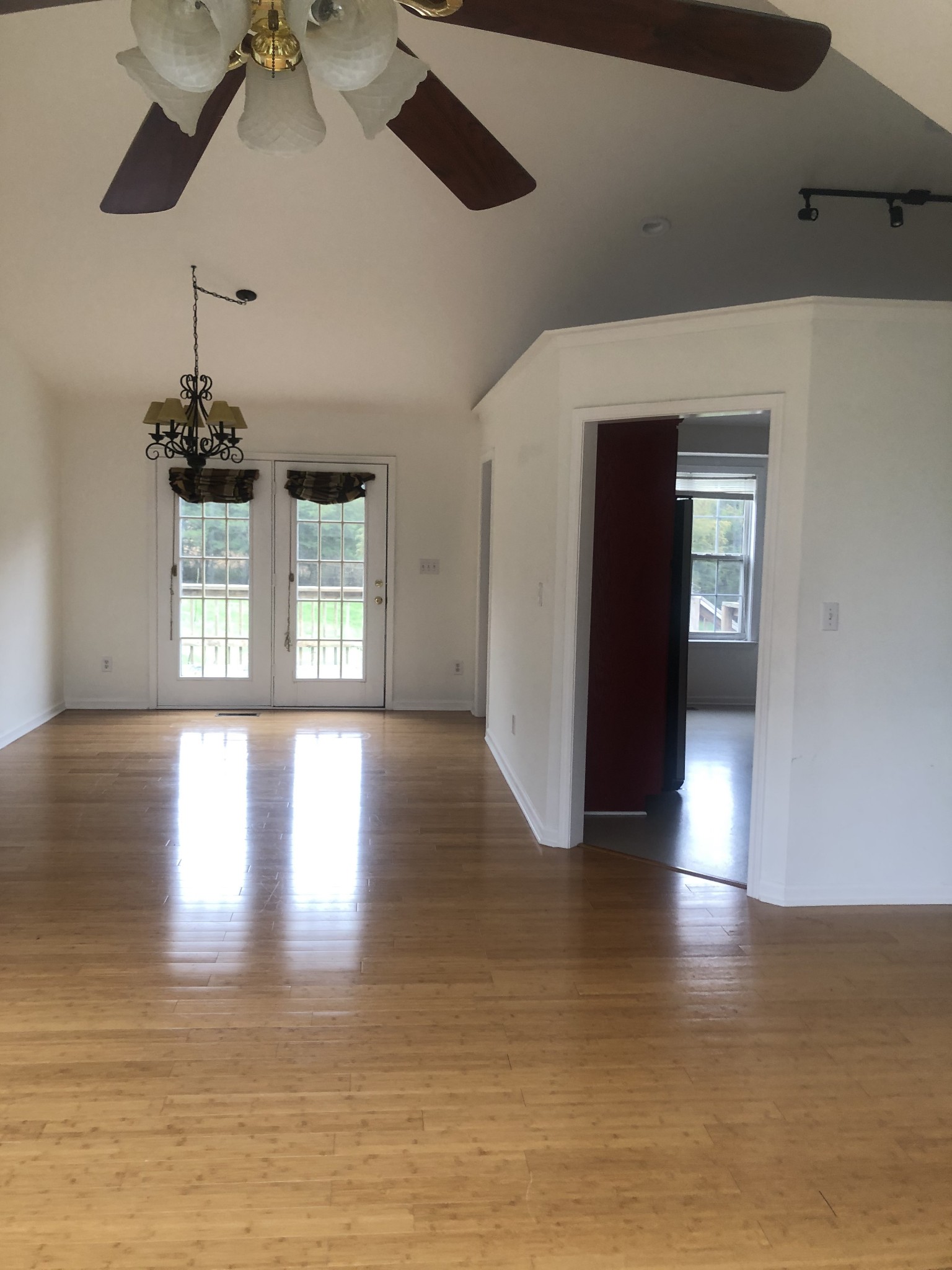 5116 Kedron Road Columbia, TN 38401 - Photo 7 of 10 a view of an empty room with wooden floor and a window