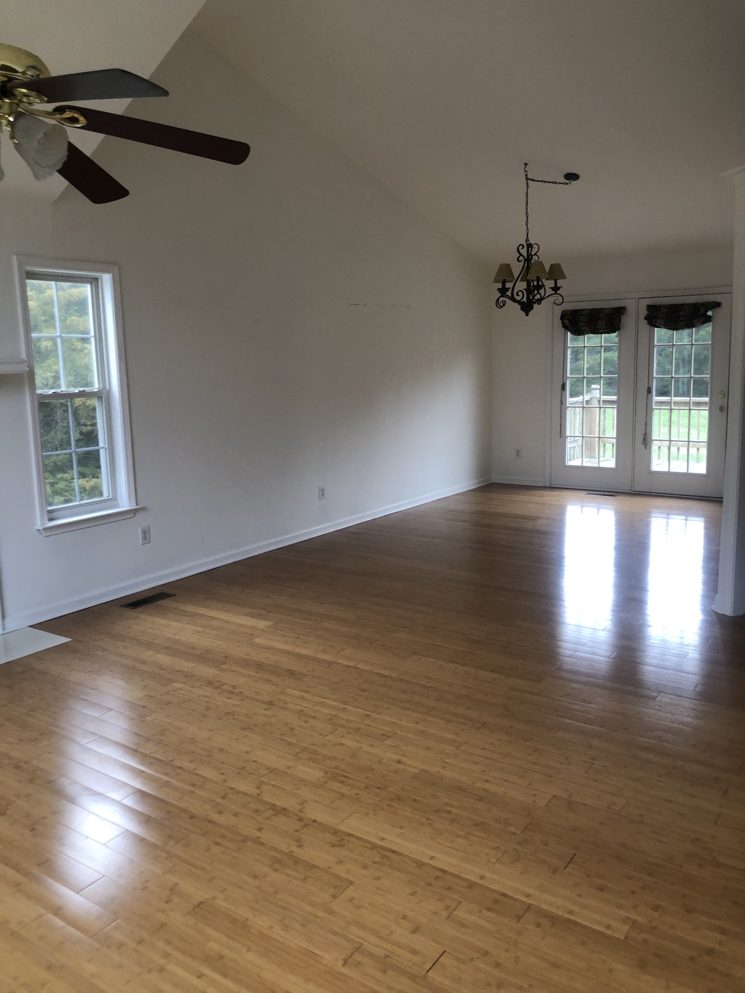 5116 Kedron Road Columbia, TN 38401 - Photo 8 of 10 an empty room with wooden floor and windows