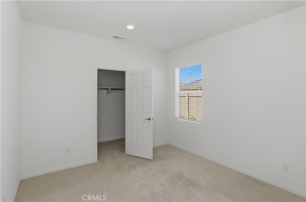 21159 Blue Jeans Court Riverside, CA 92507 - Photo 45 of 63 an empty room with windows and closet