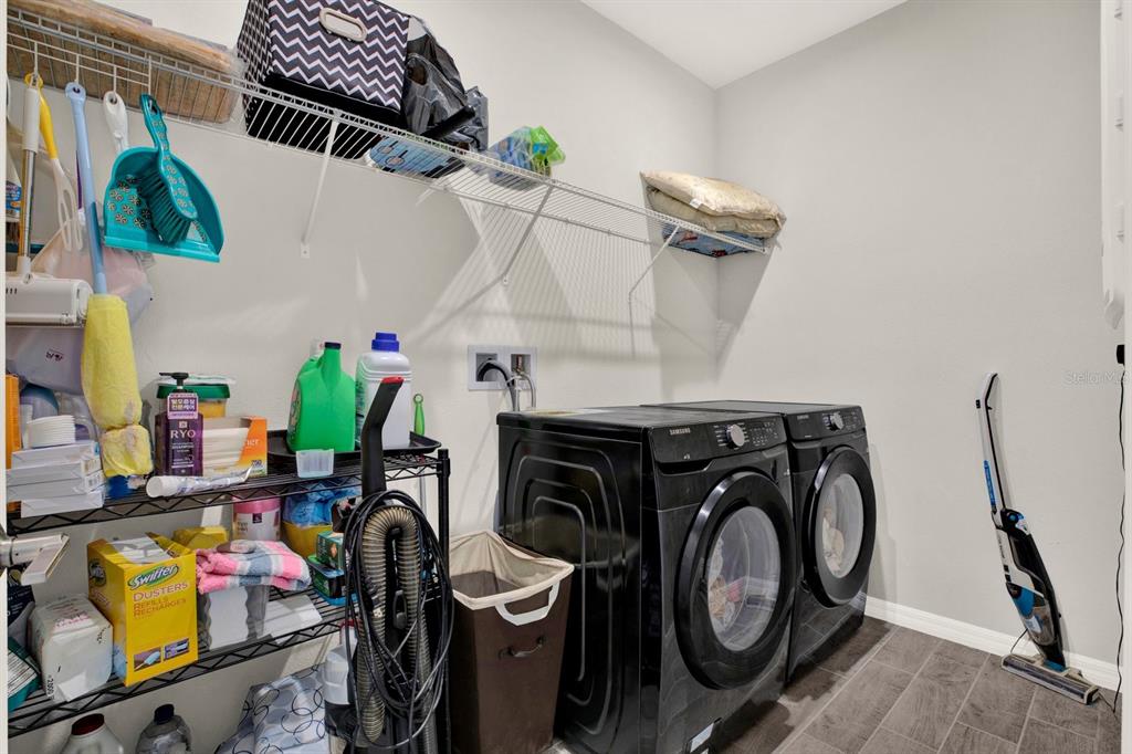 13729 Rangeland Boulevard Odessa, FL 33556 - Photo 17 of 30 a utility room with dryer and washer