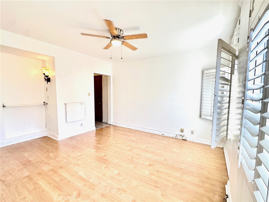 140 Linden Avenue, Unit 316 Long Beach, CA 90802 - Photo 5 of 11 a view of a room with a ceiling fan