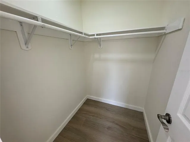 a spacious bedroom with two beds and a couch