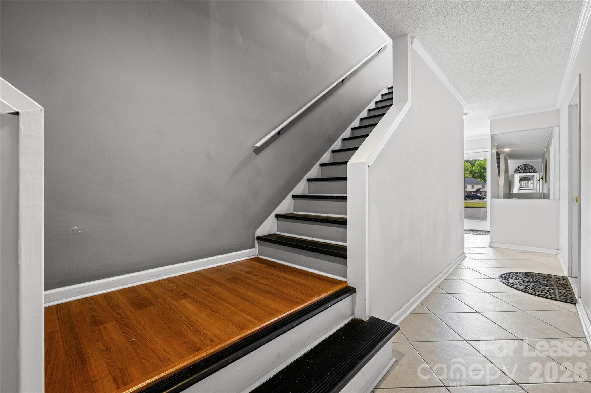 113 Stroupe Road, Unit E Gastonia, NC 28056 - Photo 3 of 33 a view of an empty room with stairs