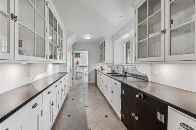 a kitchen with stainless steel appliances granite countertop a sink and cabinets