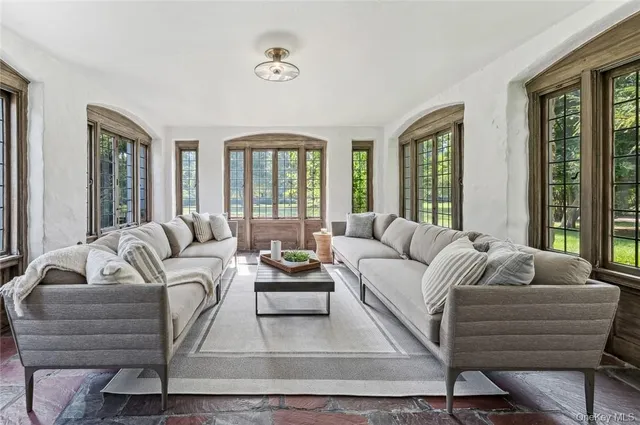 a living room with furniture and windows