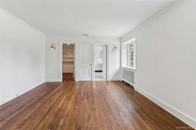 an empty room with wooden floor