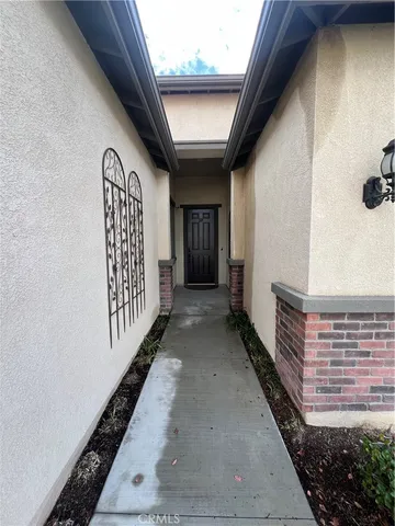 a view of a house with wooden fence