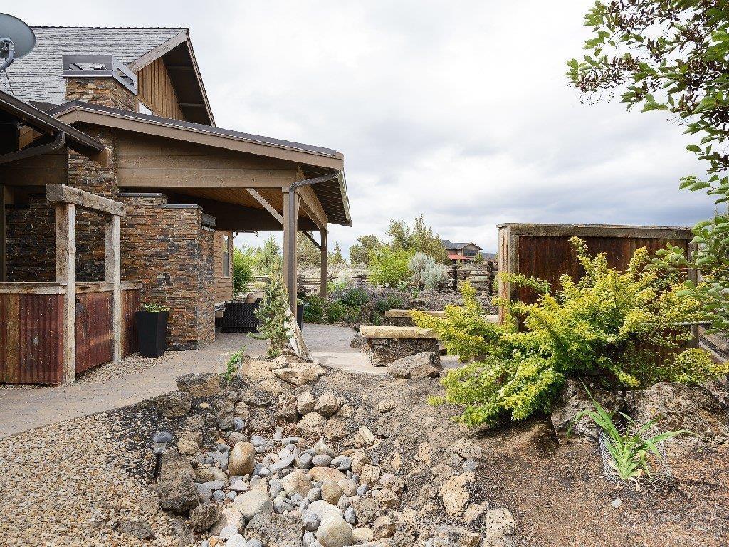 16464 Southwest Ranchview Road Powell Butte, OR 97753 - Photo 19 of 24 Nicely Landscaped with Rock Outcroppings