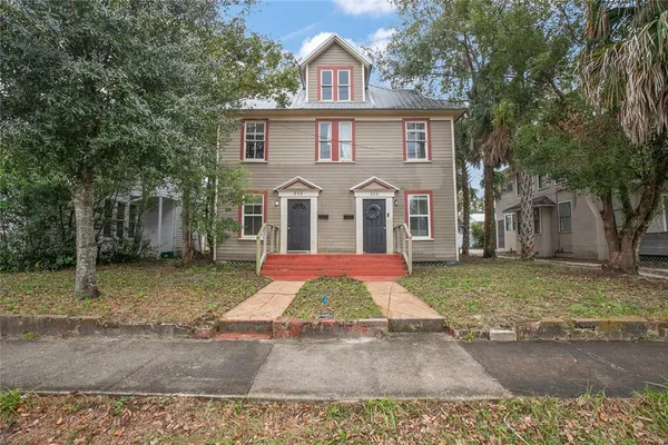 a front view of a house with yard