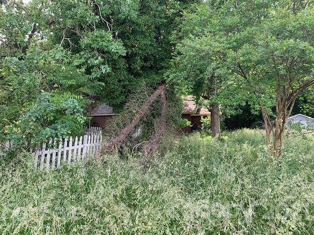 1715 Trinity Church Road Monroe, NC 28112 - Photo 3 of 3 a backyard of a house with outdoor seating and green space