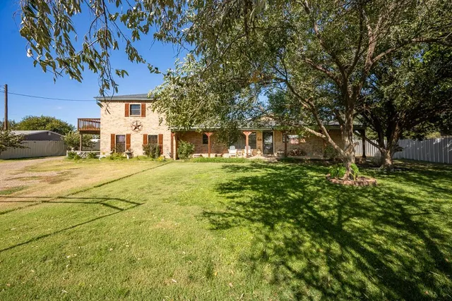 a view of a house with a big yard