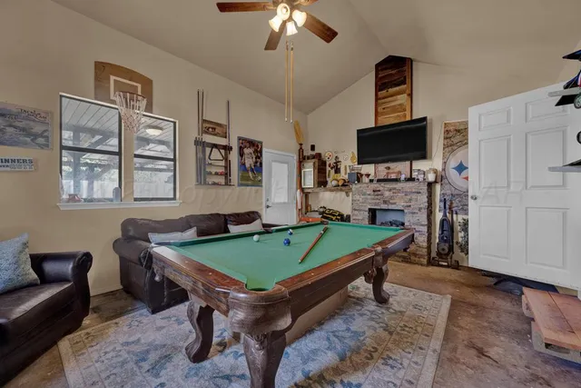 a room with furniture and flat screen tv