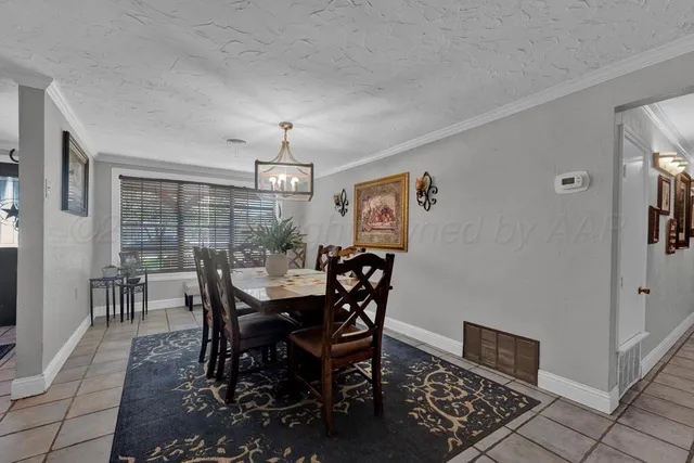 a view of a dining room with furniture and window