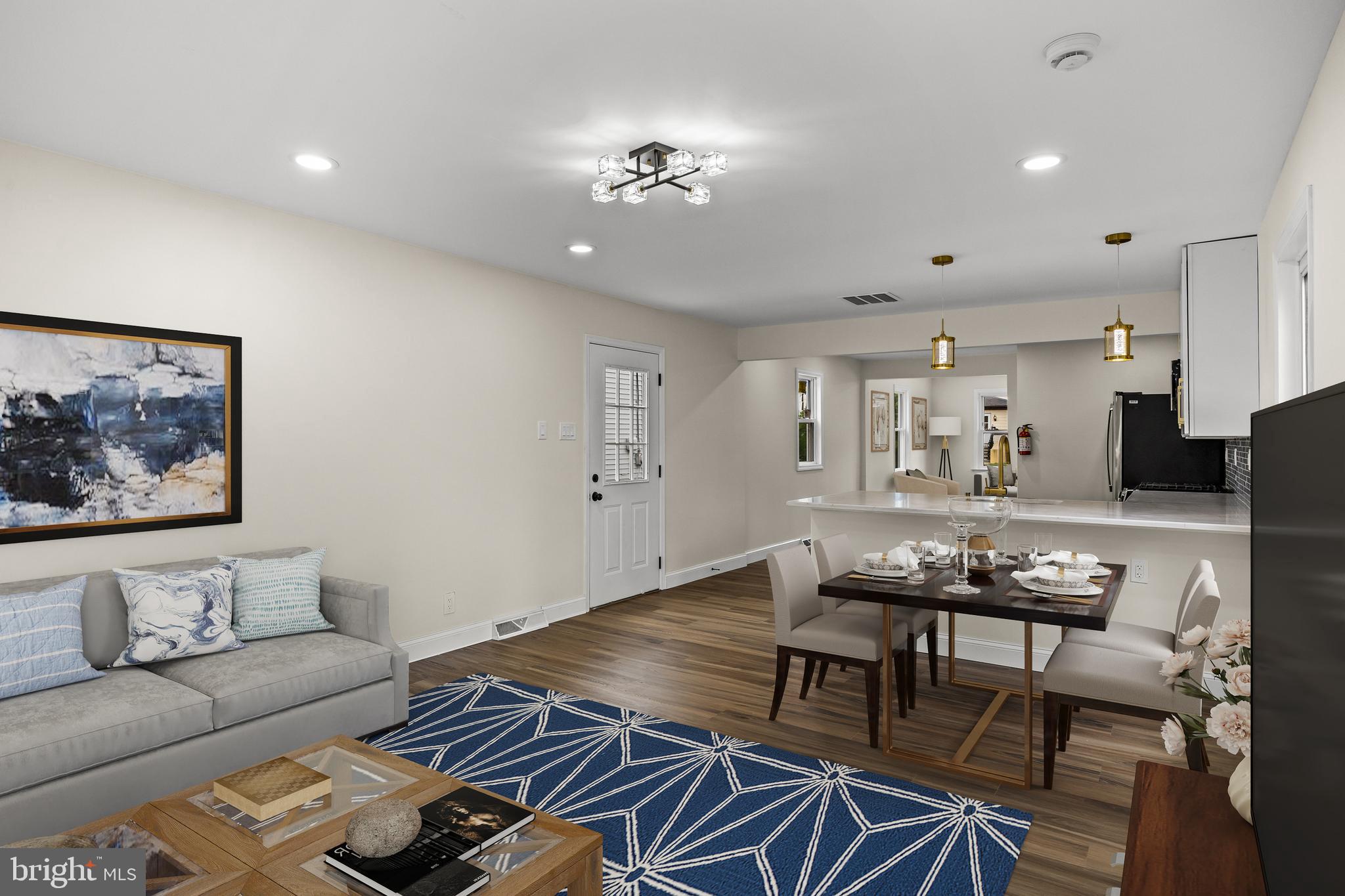 937 Clements Bridge Road Barrington, NJ 08007 - Photo 18 of 34 a living room with furniture and a chandelier