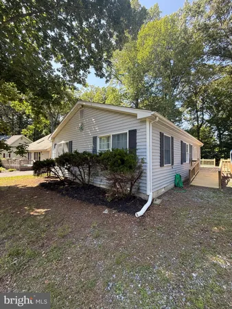 a view of a house with a yard and garage