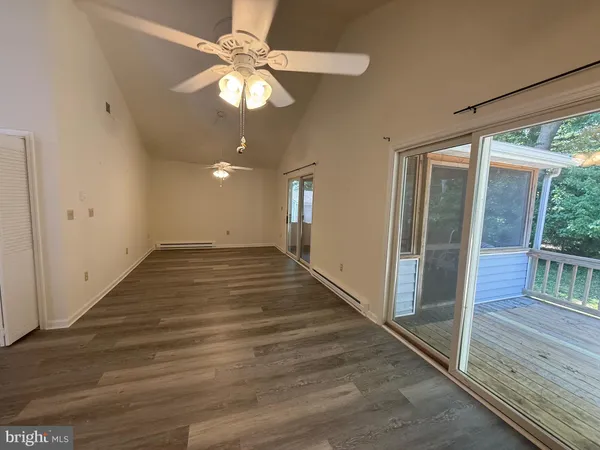 a view of a livingroom with wooden floor