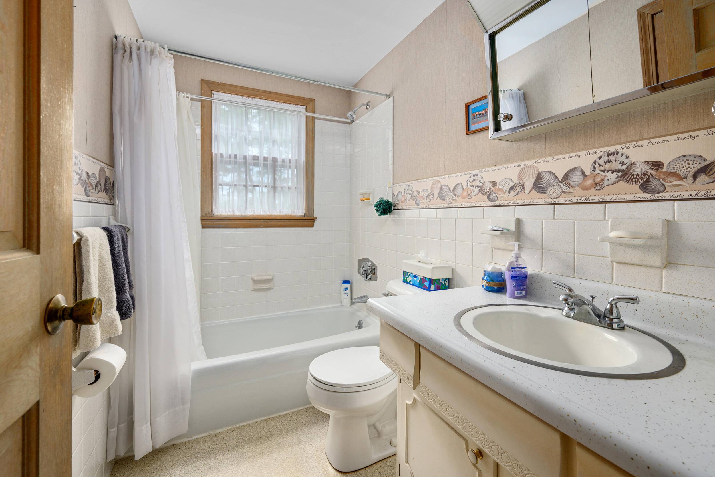 59 Beverly Road West Yarmouth, MA 02673 - Photo 26 of 33 a bathroom with a sink a toilet and a bathtub