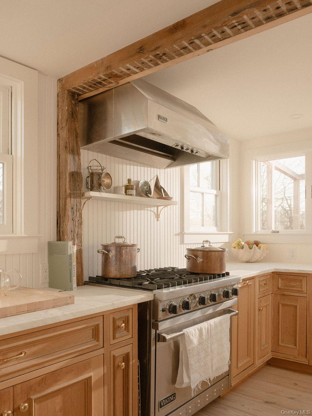 7220 Main Road East Marion, NY 11939 - Photo 11 of 44 a kitchen with stainless steel appliances a sink and a stove