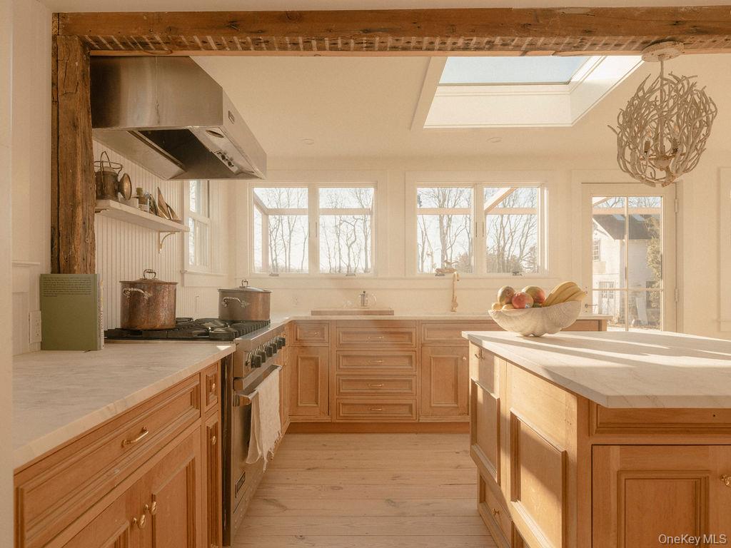 7220 Main Road East Marion, NY 11939 - Photo 12 of 44 a kitchen with a sink and cabinets