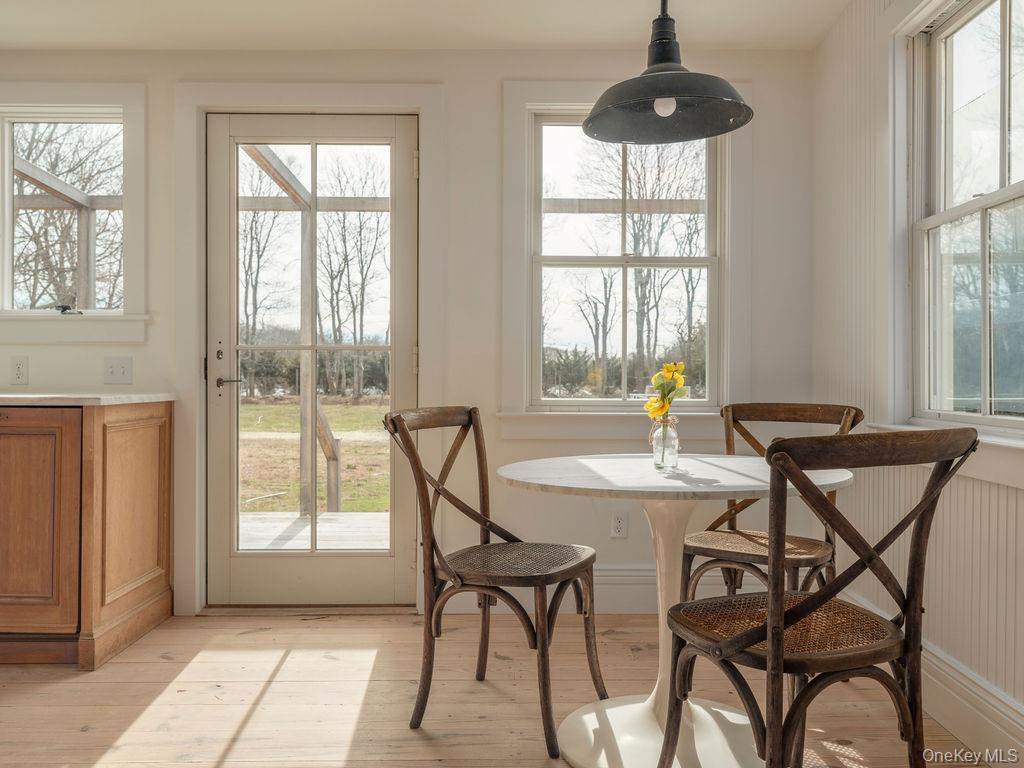 7220 Main Road East Marion, NY 11939 - Photo 14 of 44 a view of a dining room with furniture and windows
