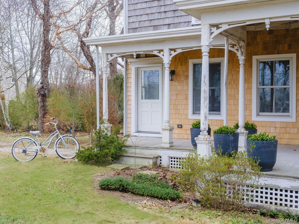 7220 Main Road East Marion, NY 11939 - Photo 2 of 44 front view of a house with a small yard
