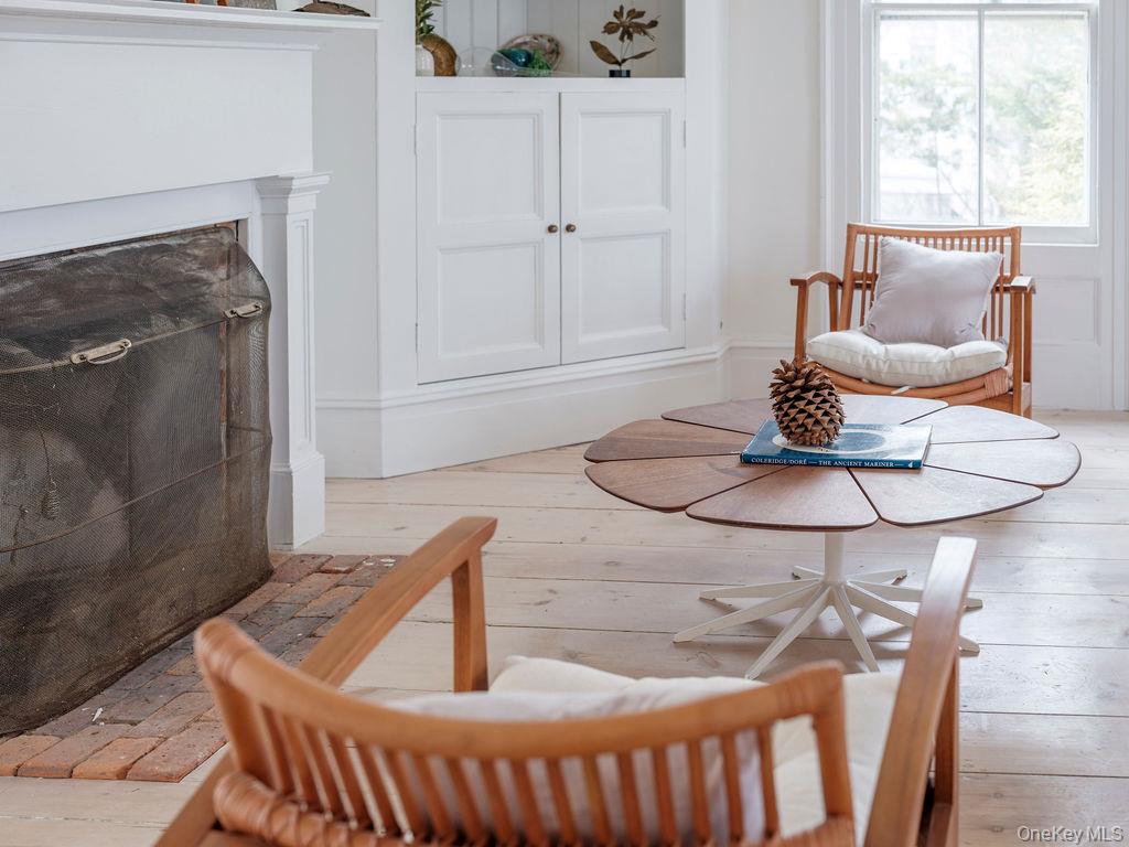 7220 Main Road East Marion, NY 11939 - Photo 23 of 44 a living room with furniture and a window