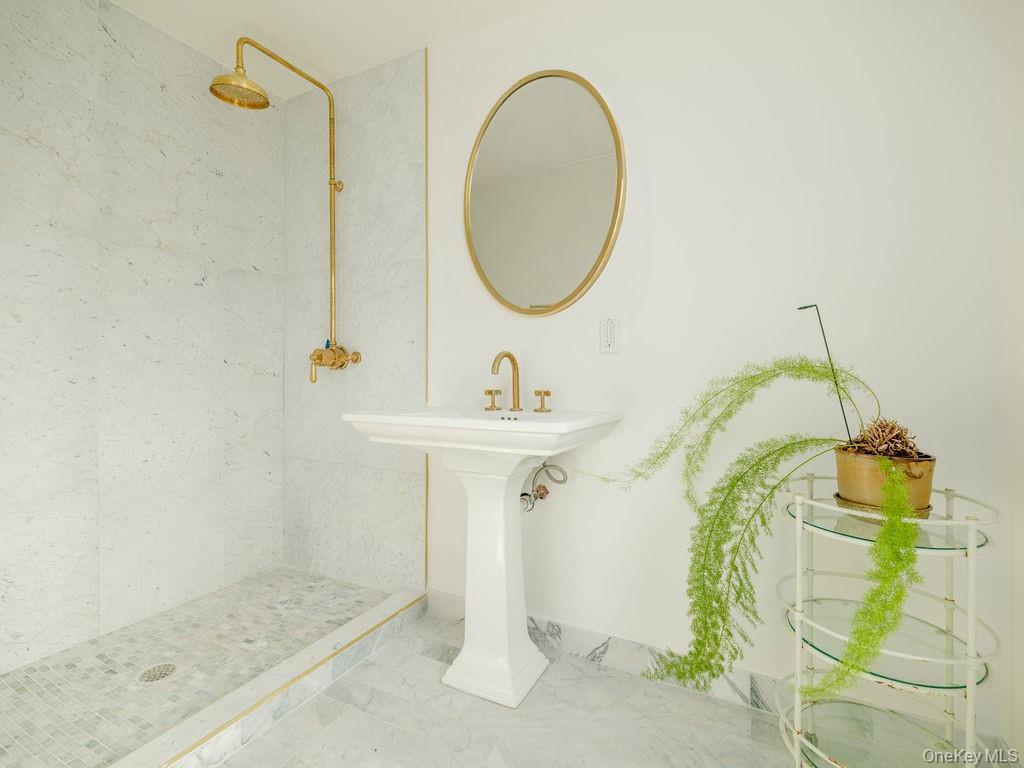 7220 Main Road East Marion, NY 11939 - Photo 31 of 44 a bathroom with a sink and a mirror