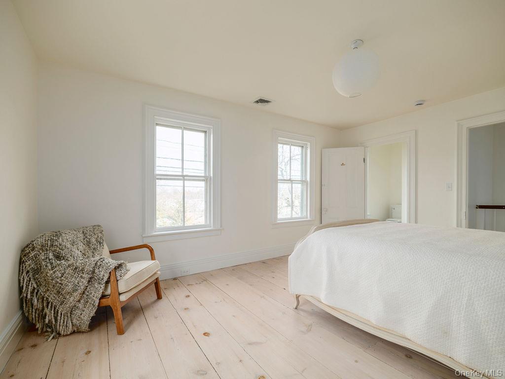 7220 Main Road East Marion, NY 11939 - Photo 33 of 44 a bedroom with a bed and a window