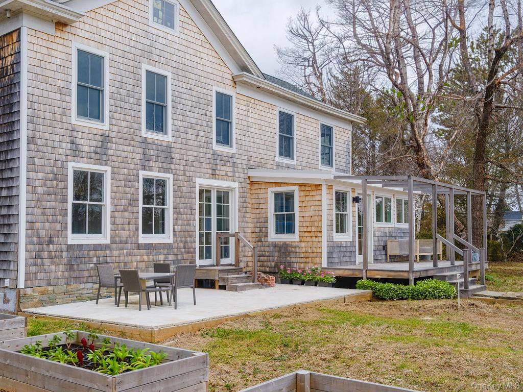 7220 Main Road East Marion, NY 11939 - Photo 39 of 44 a front view of a house with garden and plants
