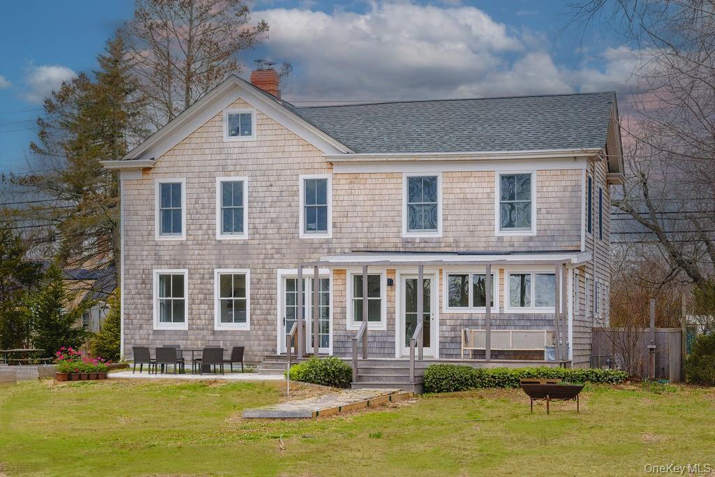 7220 Main Road East Marion, NY 11939 - Photo 40 of 44 a front view of a house with a yard with swimming pool