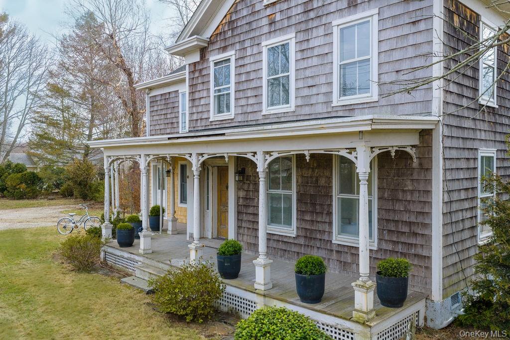 7220 Main Road East Marion, NY 11939 - Photo 4 of 44 front view of a building with a garden