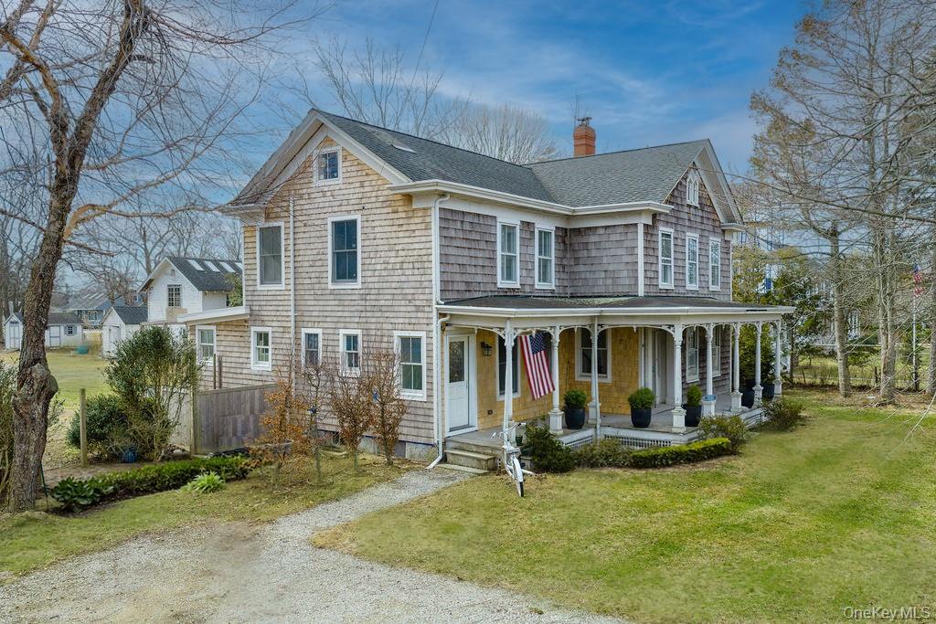 7220 Main Road East Marion, NY 11939 - Photo 5 of 44 a front view of a house with garden
