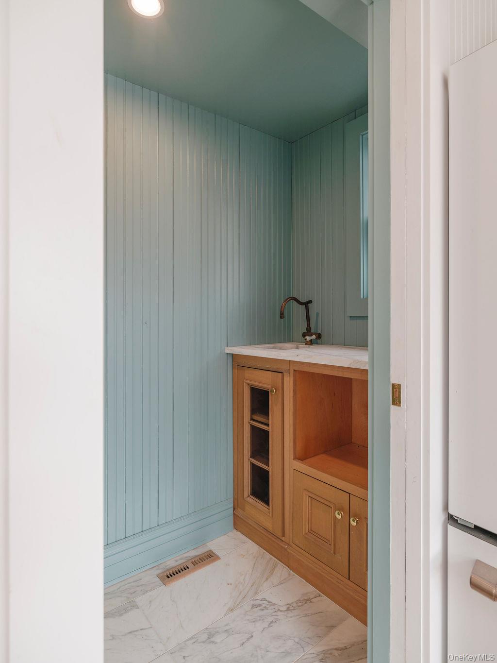 7220 Main Road East Marion, NY 11939 - Photo 10 of 44 a bathroom with a sink and a mirror