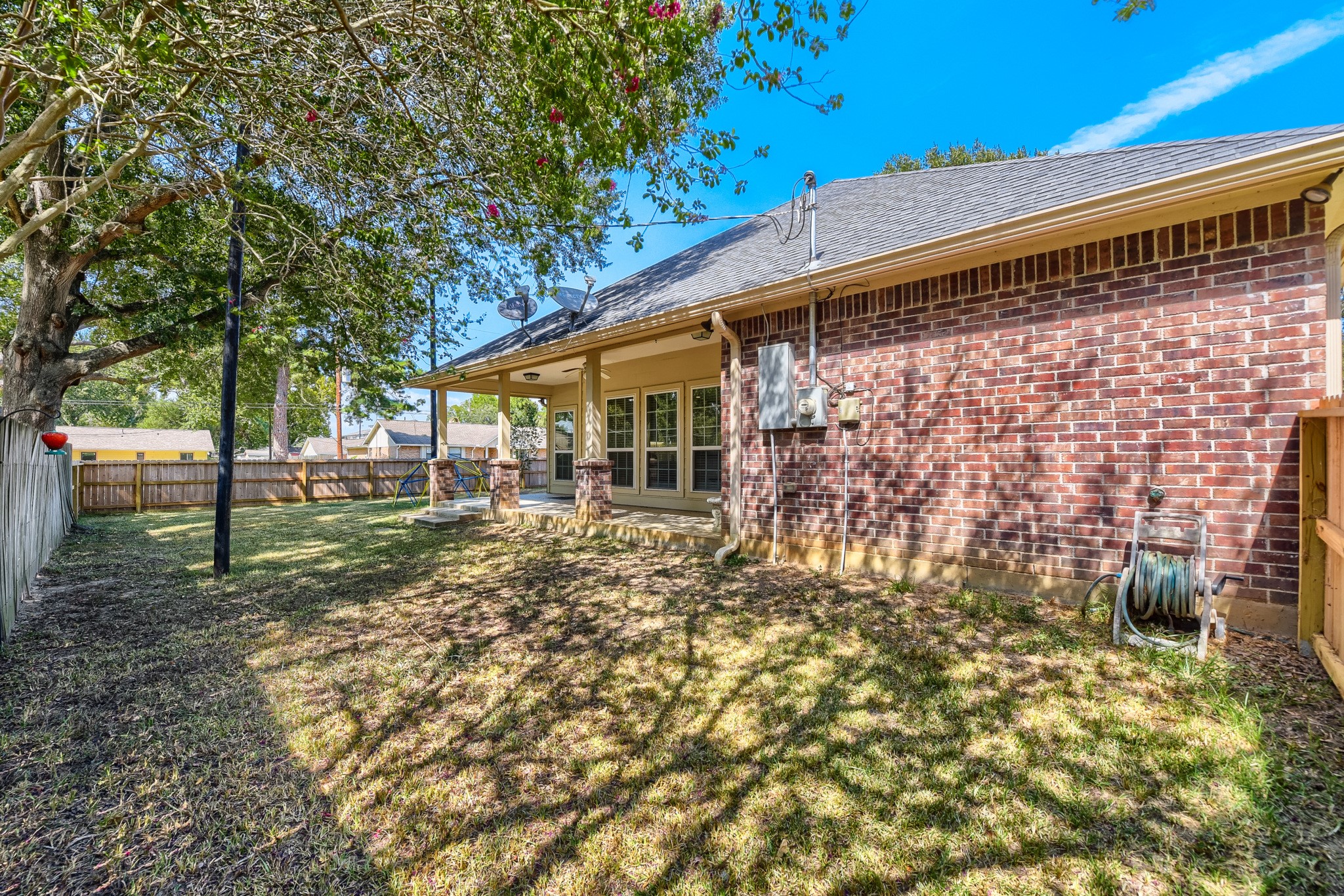 2215 Penick Road Waller, TX 77484 - Photo 31 of 33 Large fully-fenced backyard with covered patio