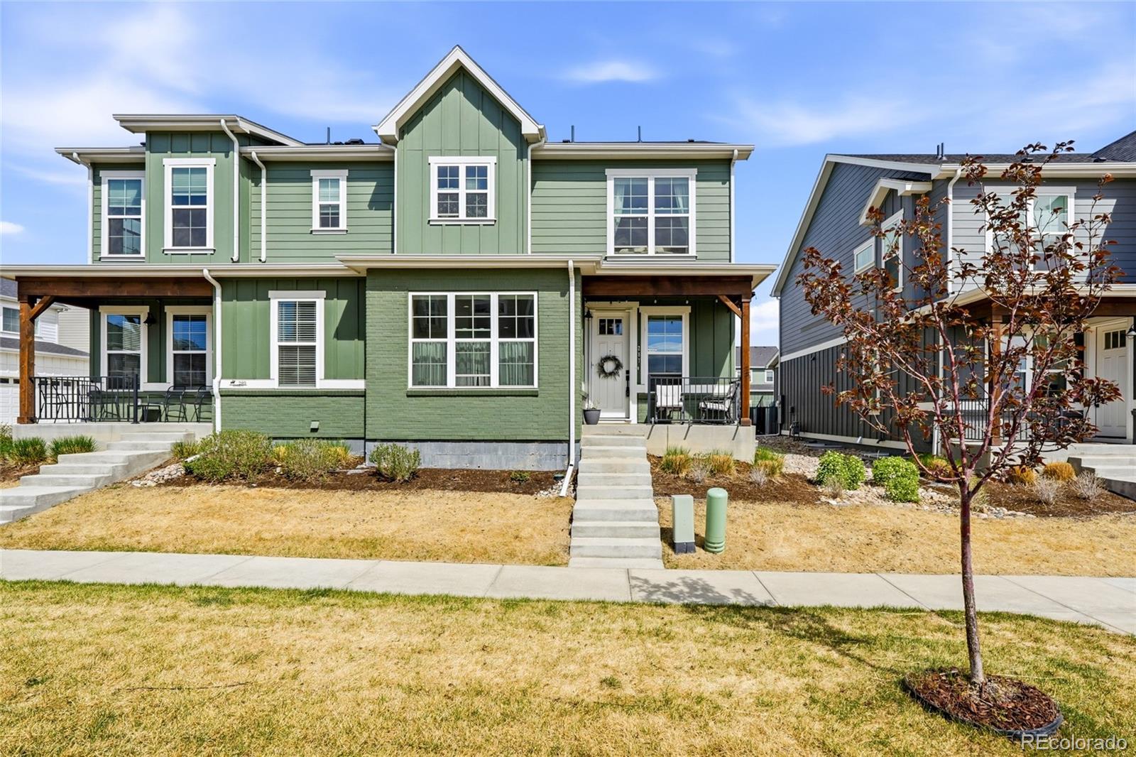 a front view of a house with a yard