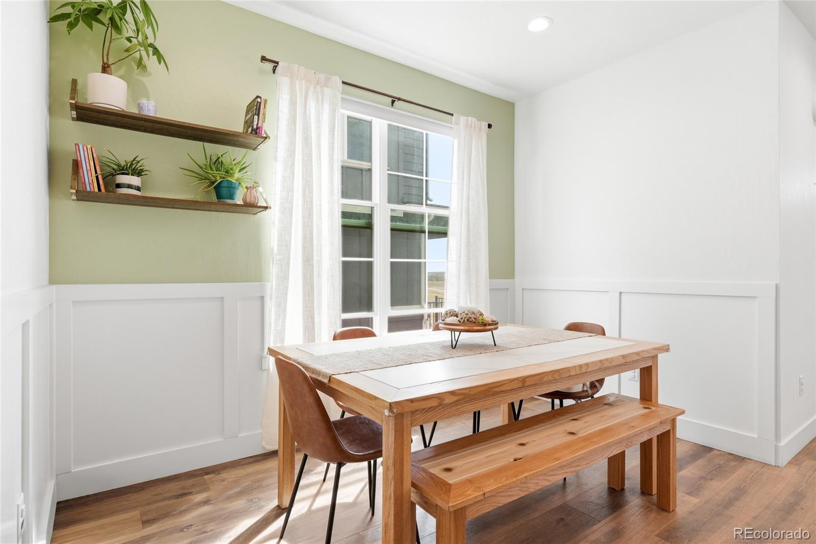 287 Dipper Court Berthoud, CO 80513 - Photo 14 of 29 a view of a dining hall with a table and chairs in it