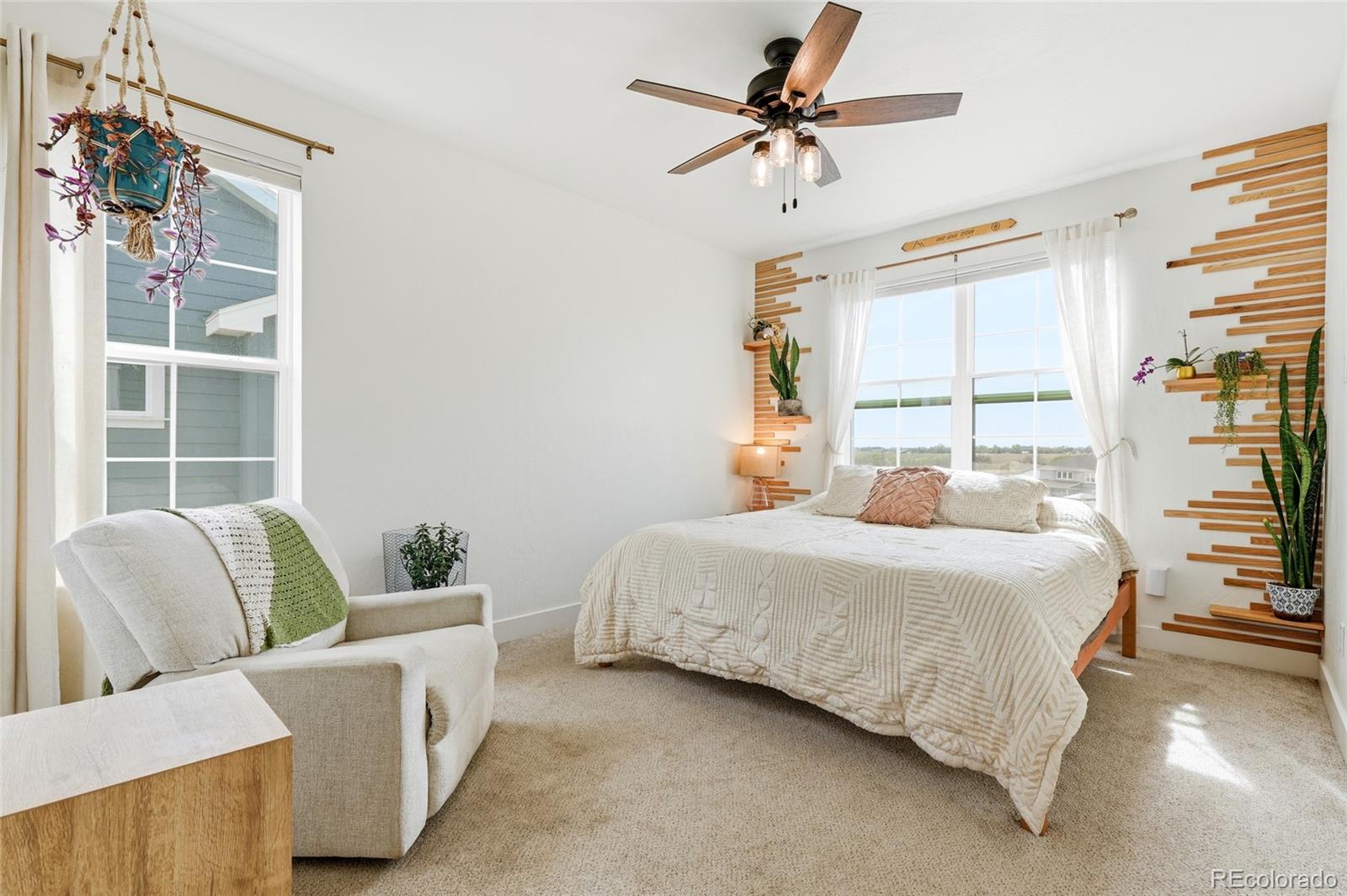 287 Dipper Court Berthoud, CO 80513 - Photo 17 of 29 a bedroom with a bed furniture and a window