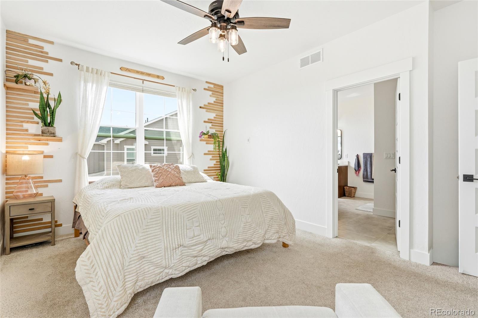 287 Dipper Court Berthoud, CO 80513 - Photo 18 of 29 a bedroom with a bed and a window