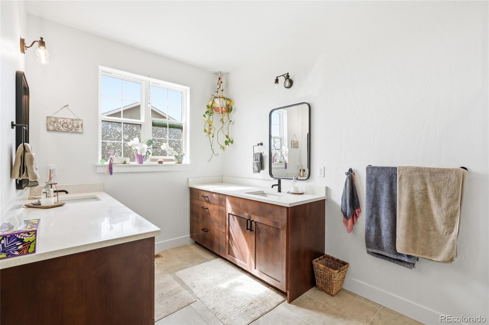 287 Dipper Court Berthoud, CO 80513 - Photo 20 of 29 a bathroom with double vanity sink and a mirror