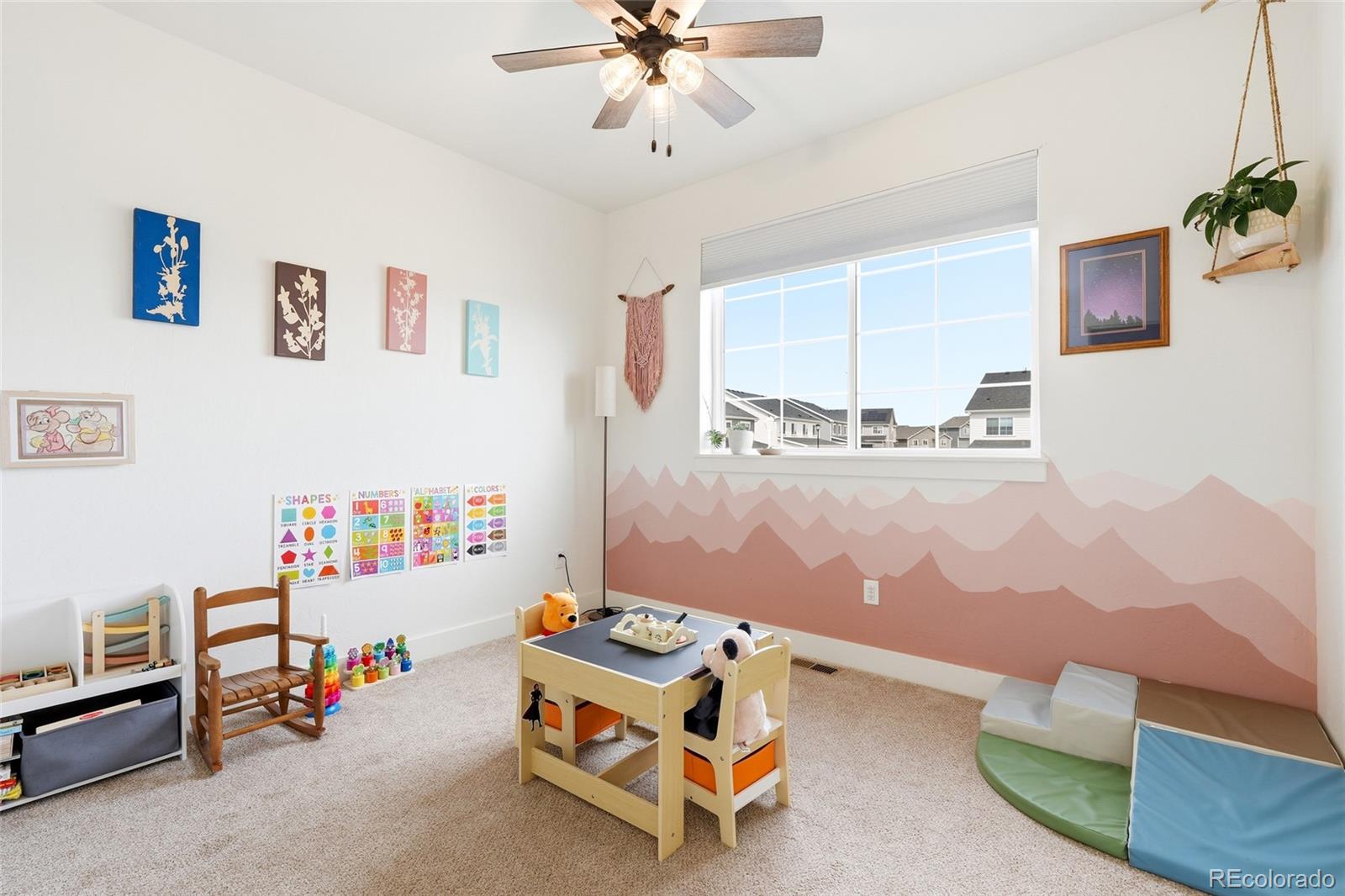 287 Dipper Court Berthoud, CO 80513 - Photo 23 of 29 a room with furniture and a chandelier fan