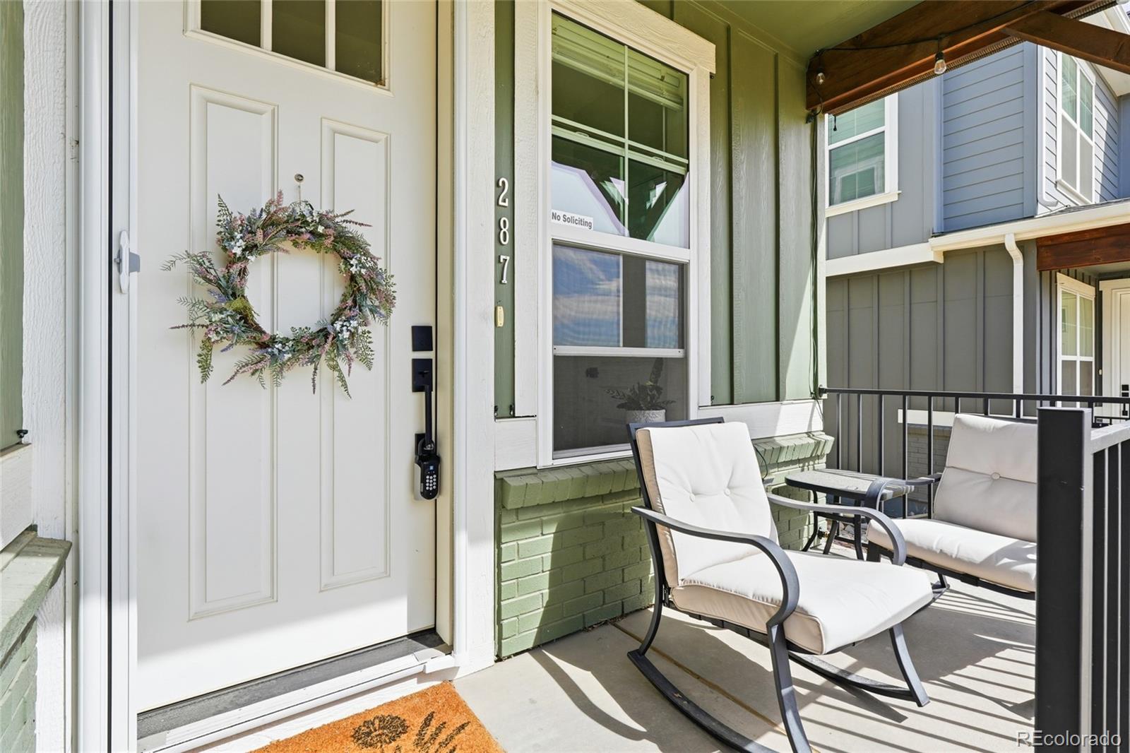 287 Dipper Court Berthoud, CO 80513 - Photo 3 of 29 a balcony with table and chairs