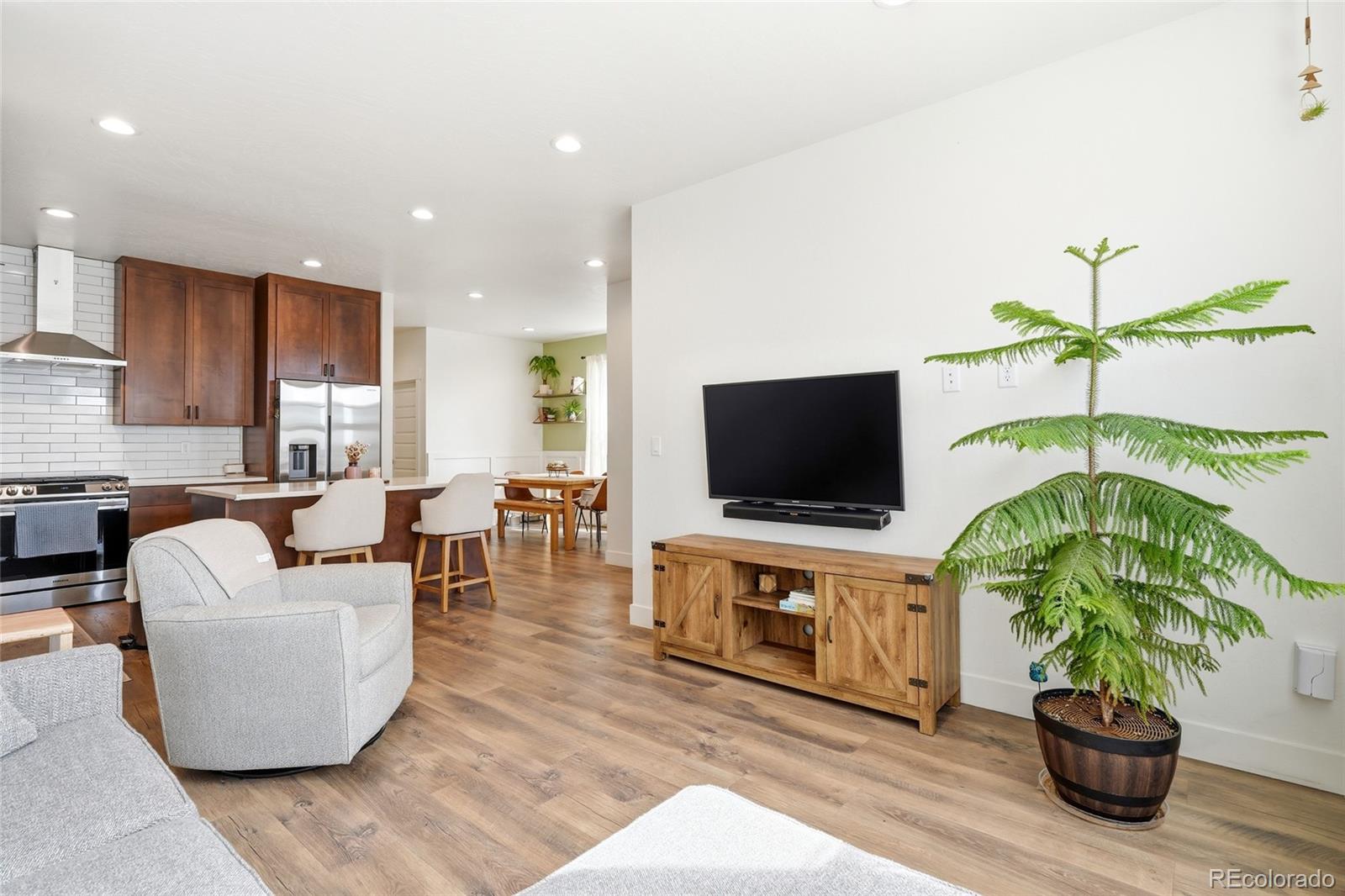 287 Dipper Court Berthoud, CO 80513 - Photo 6 of 29 a living room with furniture and a flat screen tv
